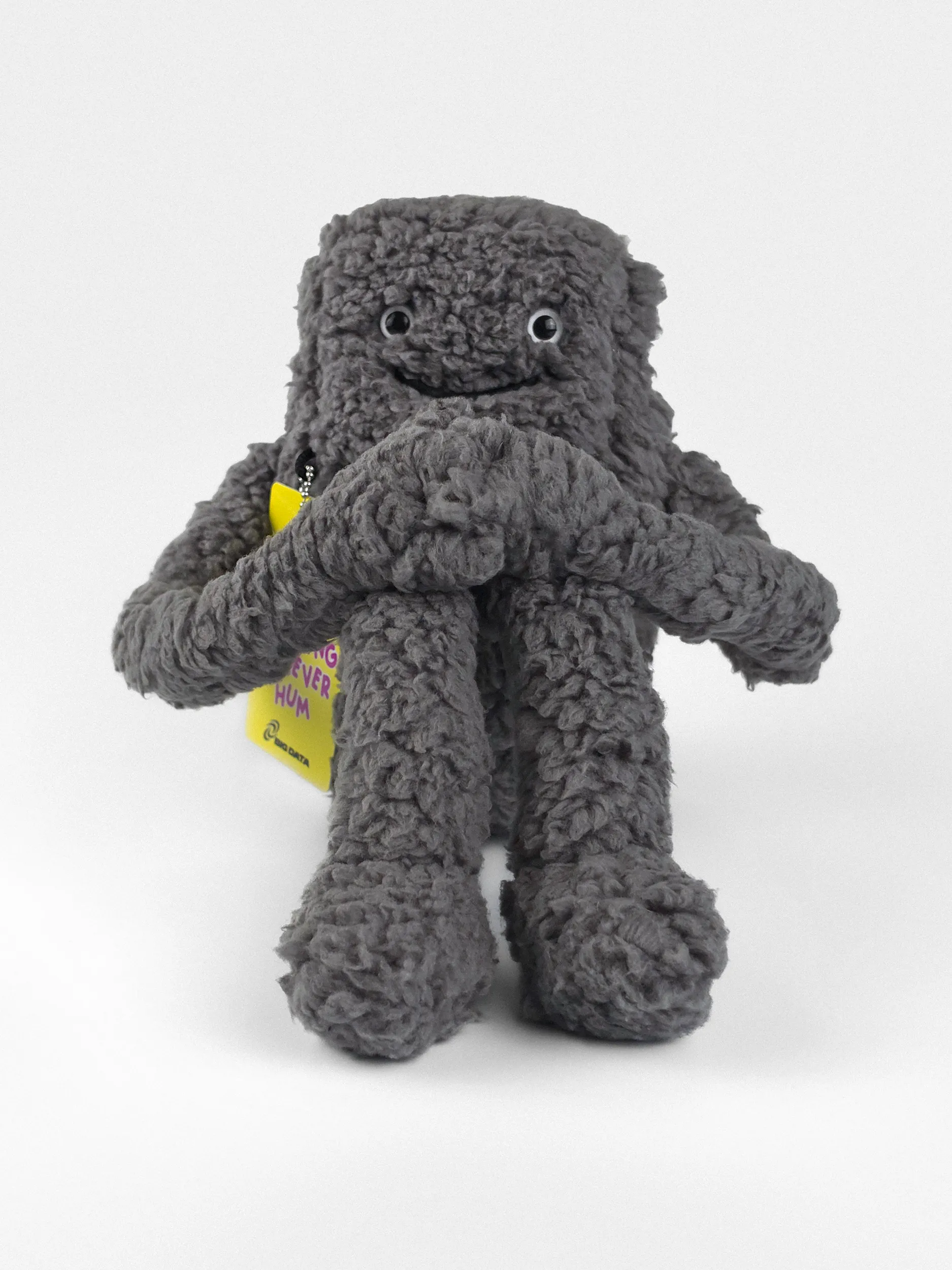 Bezzy plush data center toy posed in thought